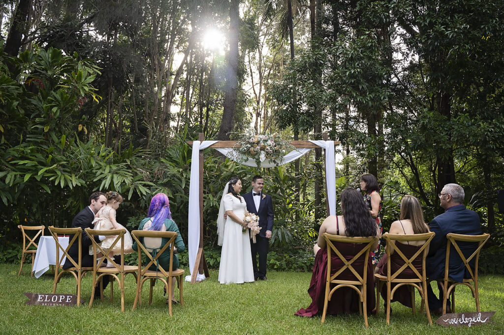 wedding ceremony arbour with drapery and flowers